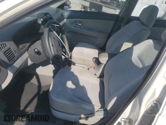 2009 Kia Spectra EX with VIN KNAFE221995624549, listed as a Copart auction lot 65963824 with 244,904 mi miles and Salvage Title. Bid and sale history available at carsss.com. Image 7.