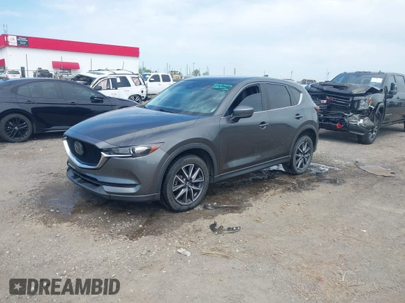 2018 Mazda CX-5 Touring with VIN JM3KFACM9J1348054, listed as a IAAI auction lot 42043458 with 120,177 mi miles. Bid and sale history available at carsss.com. Image 2.