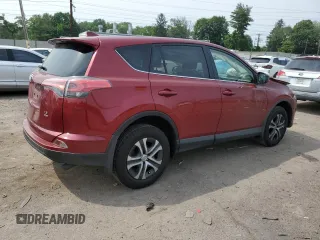 2018 Toyota RAV4 LE with VIN JTMBFREV2JD233808, listed as a Copart auction lot 59021235 with 71,430 mi miles and Salvage title. Bid and sale history available at DreamBid. Image 3.