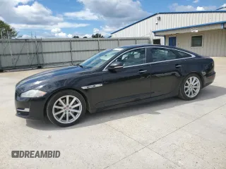 2018 Jaguar XJ with VIN SAJWA1C76J8W14271, listed as a Copart auction lot 73777914 with 124,155 mi miles and Salvage Title. Bid and sale history available at carsss.com. Image 1.