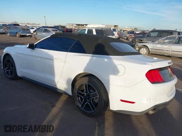 2021 Ford Mustang EcoBoost with VIN 1FATP8UH2M5120338, listed as a IAAI auction lot 40958016 with 76,979 mi miles. Bid and sale history available at carsss.com. Image 3.