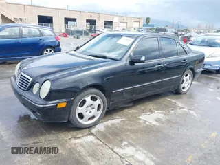 2000 Mercedes-Benz E-Class with VIN WDBJF65JXYA997410, listed as a IAAI auction lot 41939485 with 158,559 mi miles. Bid and sale history available at carsss.com. Image 2.