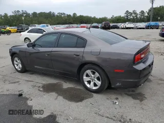 2014 Dodge Charger SXT z VIN 2C3CDXHGXEH261414, wystawiony jako Copart lot #55871705 z przebiegiem 221 000 mil mil oraz Szkoda całkowita • Salvage title. Historia ofert i sprzedaży dostępna na DreamBid. Obrazek 2.