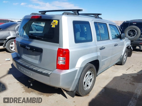 2010 Jeep Patriot Sport with VIN 1J4NT2GB1AD519675, listed as a IAAI auction lot 41321426 with 239,093 mi miles. Bid and sale history available at carsss.com. Image 4.