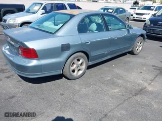 1999 Mitsubishi Galant ES with VIN 4A3AA46G4XE114767, listed as a IAAI auction lot 41885640 with 126,480 mi miles. Bid and sale history available at carsss.com. Image 4.