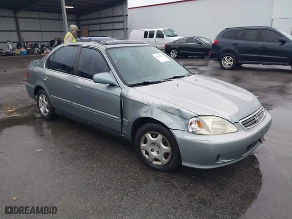 1999 Honda Civic EX with VIN 1HGEJ8643XL010821, listed as a IAAI auction lot 41602036 with 165,139 mi miles. Bid and sale history available at carsss.com. Image 1.