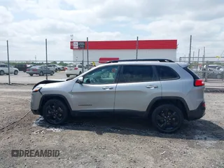 2016 Jeep Cherokee Latitude with VIN 1C4PJLCB3GW176901, listed as a IAAI auction lot 42019983 with 141,104 mi miles and . Bid and sale history available at DreamBid. Image 14.