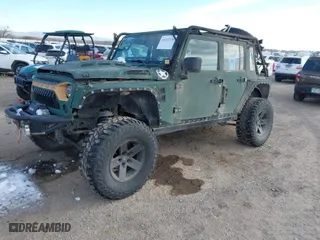 2010 Jeep Wrangler Unlimited Sport with VIN 1J4BA3H12AL230749, listed as a IAAI auction lot 41052278 with 156,217 mi miles. Bid and sale history available at carsss.com. Image 2.