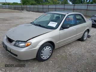 2001 Mazda Protege LX z VIN JM1BJ226210439446, wystawiony jako IAAI lot #42336976 z przebiegiem 155 990 mil mil oraz . Historia ofert i sprzedaży dostępna na DreamBid. Obrazek 2.
