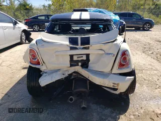 2014 MINI Coupe S z VIN WMWSX3C54ET772839, wystawiony jako Copart lot #73992794 z przebiegiem 100 580 mil mil oraz Nie do naprawy. Historia ofert i sprzedaży dostępna na DreamBid. Obrazek 6.