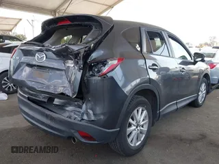 2014 Mazda CX-5 Touring with VIN JM3KE2CY9E0384401, listed as a IAAI auction lot 41699913 with 75,301 mi miles. Bid and sale history available at carsss.com. Image 4.