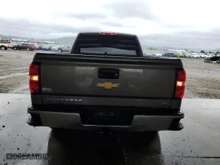 2015 Chevrolet Silverado 1500 LT with VIN 1GCUKREC5FF199913, listed as a Copart auction lot 58476584 with 129,616 mi miles and Salvage Title. Bid and sale history available at carsss.com. Image 6.
