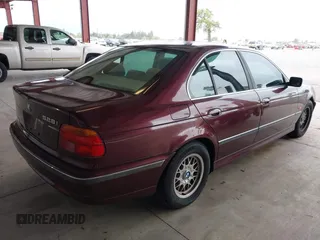 1997 BMW 5 Series 528iA with VIN WBADD6323VBW15656, listed as a IAAI auction lot 41777667 with 142,443 mi miles. Bid and sale history available at carsss.com. Image 4.