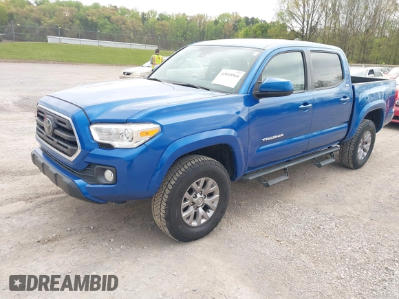2018 Toyota Tacoma SR5 with VIN 3TMAZ5CNXJM069212, listed as a IAAI auction lot 42010564 with 73,825 mi miles and . Bid and sale history available at DreamBid. Image 2.