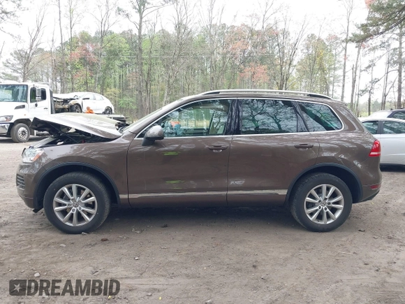 2014 Volkswagen Touareg Sport with VIN WVGEF9BP2ED007904, listed as a IAAI auction lot 41960811 with 126,230 mi miles and . Bid and sale history available at DreamBid. Image 14.