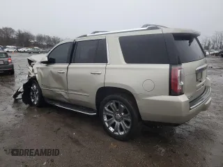 2015 GMC Yukon Denali with VIN 1GKS2CKJ3FR592707, listed as a Copart auction lot 47581575 with 121,326 mi miles and Salvage Title. Bid and sale history available at carsss.com. Image 2.