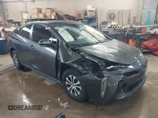 2021 Toyota Prius LE z VIN JTDL9MFU1M3022680, wystawiony jako IAAI lot #40904006 z przebiegiem 146 138 mil mil oraz . Historia ofert i sprzedaży dostępna na DreamBid. Obrazek 1.