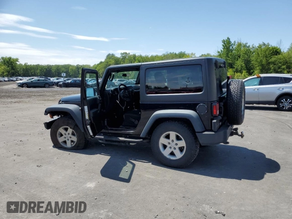 2014 Jeep Wrangler Sport with VIN 1C4AJWAG2EL113843, listed as a Copart auction lot 62771115 with 70,089 mi miles and Salvage title. Bid and sale history available at DreamBid. Image 2.