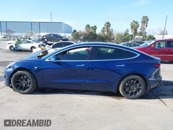 2018 Tesla Model 3 Long Range Battery with VIN 5YJ3E1EA4JF011799, listed as a IAAI auction lot 41765860 with 133,098 mi miles. Bid and sale history available at carsss.com. Image 14.
