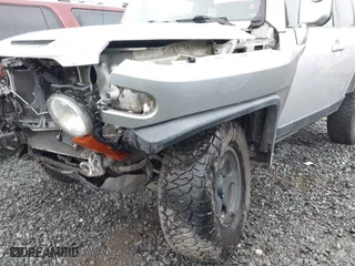 2007 Toyota FJ Cruiser with VIN JTEBU11F570032163, listed as a IAAI auction lot 41999403 with 179,064 mi miles. Bid and sale history available at carsss.com. Image 6.