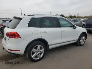 2013 Volkswagen Touareg Sport с VIN WVGEP9BP9DD003974, выставлен на аукционе Copart как лот 75106234 с пробегом 211 323 миль миль и Чистый • Clean title. История ставок и продаж доступна на DreamBid. Изображение 3.