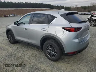 2021 Mazda CX-5 Touring with VIN JM3KFACM2M0451083, listed as a Copart auction lot 49999935 with 59,927 mi miles and Salvage Title. Bid and sale history available at carsss.com. Image 2.