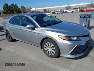 2021 Toyota Camry Hybrid LE with VIN 4T1C31AK5MU030969, listed as a IAAI auction lot 41862078 with 125,992 mi miles. Bid and sale history available at carsss.com. Image 1.