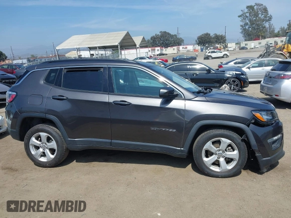 2019 Jeep Compass Latitude with VIN 3C4NJDBB8KT729491, listed as a IAAI auction lot 42489691 with 73,022 mi miles and . Bid and sale history available at DreamBid. Image 14.