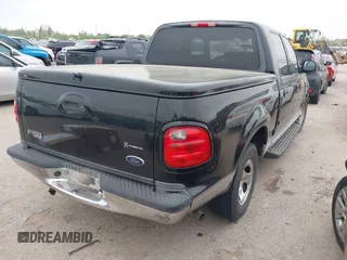 2003 Ford F-150 XLT with VIN 1FTRW07613KD14135, listed as a IAAI auction lot 41879756 with 197,515 mi miles. Bid and sale history available at carsss.com. Image 4.