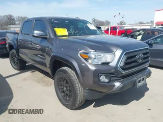 2021 Toyota Tacoma SR z VIN 5TFCZ5ANXMX270361, wystawiony jako IAAI lot #41742749 z przebiegiem 73 686 mil mil oraz . Historia ofert i sprzedaży dostępna na DreamBid. Obrazek 1.
