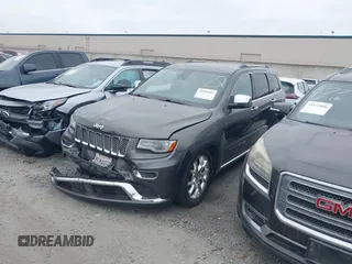 2014 Jeep Grand Cherokee Summit with VIN 1C4RJFJG8EC434899, listed as a IAAI auction lot 42399912 with 186,840 mi miles and . Bid and sale history available at DreamBid. Image 2.