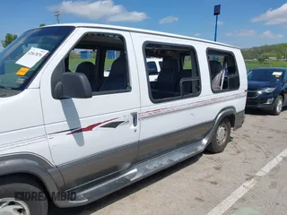 1999 Ford Econoline Cargo Recreational with VIN 1FDRE14L2XHA41059, listed as a IAAI auction lot 42067879 with 149,185 mi miles. Bid and sale history available at carsss.com. Image 6.