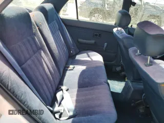 1991 Toyota Corolla z VIN JT2AE94A6M3427211, wystawiony jako Copart lot #60075885 z przebiegiem 179 936 mil mil oraz Czysty tytuł • Clean title. Historia ofert i sprzedaży dostępna na DreamBid. Obrazek 10.