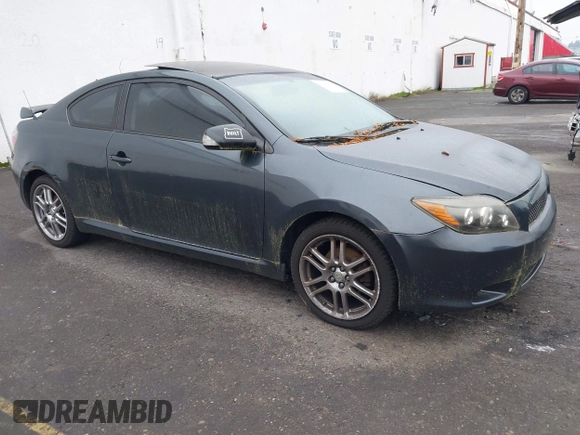 2010 Scion tC with VIN JTKDE3B75A0314185, listed as a IAAI auction lot 41369224 with 164,244 mi miles. Bid and sale history available at carsss.com. Image 1.