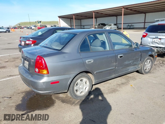 2004 Hyundai Accent GL with VIN KMHCG45C04U531177, listed as a IAAI auction lot 41526033 with 126,102 mi miles. Bid and sale history available at carsss.com. Image 4.