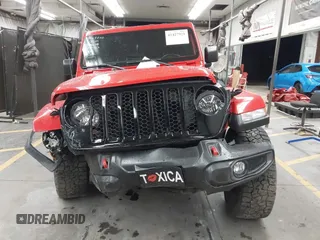 2022 Jeep Gladiator Altitude z VIN 1C6HJTAGXNL117353, wystawiony jako IAAI lot #42427921 z przebiegiem 28 801 mil mil oraz . Historia ofert i sprzedaży dostępna na DreamBid. Obrazek 12.