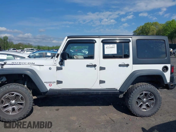 2014 Jeep Wrangler Unlimited Rubicon X with VIN 1C4BJWFG6EL240849, listed as a IAAI auction lot 42216082 with 118,912 mi miles and . Bid and sale history available at DreamBid. Image 14.