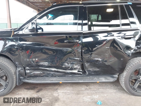 2015 Chevrolet Tahoe LT with VIN 1GNSKBKCXFR604401, listed as a IAAI auction lot 42048559 with 60,768 mi miles and . Bid and sale history available at DreamBid. Image 6.