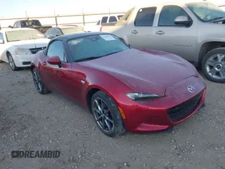 2023 Mazda MX-5 Miata Grand Touring z VIN JM1NDAD7XP0557712, wystawiony jako IAAI lot #41402925 z przebiegiem 4 787 mil mil oraz . Historia ofert i sprzedaży dostępna na DreamBid. Obrazek 1.