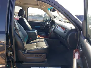 2013 Chevrolet Tahoe LTZ with VIN 1GNSKCE0XDR350970, listed as a IAAI auction lot 41704253 with 126,653 mi miles and . Bid and sale history available at DreamBid. Image 5.