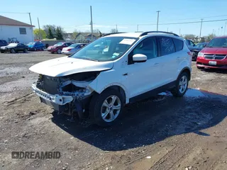 2014 Ford Escape SE with VIN 1FMCU0GX6EUA20379, listed as a IAAI auction lot 42082363 with 129,059 mi miles. Bid and sale history available at carsss.com. Image 2.