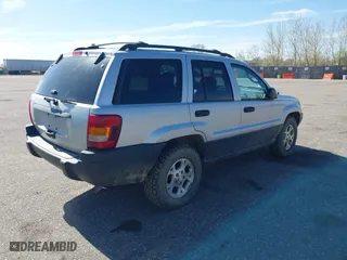 2003 Jeep Grand Cherokee Laredo with VIN 1J4GW48S03C567770, listed as a IAAI auction lot 42028727 with 245,728 mi miles. Bid and sale history available at carsss.com. Image 4.