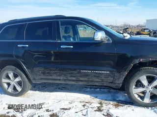 2015 Jeep Grand Cherokee Overland z VIN 1C4RJFCG3FC726748, wystawiony jako IAAI lot #41369715 z przebiegiem 120 905 mil mil oraz . Historia ofert i sprzedaży dostępna na DreamBid. Obrazek 13.