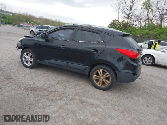 2011 Hyundai Tucson Limited with VIN KM8JUCACXBU293660, listed as a IAAI auction lot 42051931 with 99,995 mi miles and . Bid and sale history available at DreamBid. Image 3.