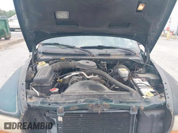 1999 Dodge Dakota SLT z VIN 1B7GG22X0XS104969, wystawiony jako IAAI lot #42493470 z przebiegiem 160 019 mil mil oraz . Historia ofert i sprzedaży dostępna na DreamBid. Obrazek 10.