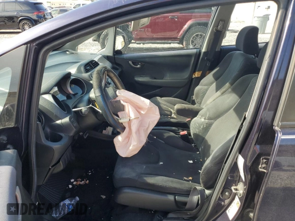 2009 Honda Fit Sport z VIN JHMGE88409S052668, wystawiony jako Copart lot #56142275 z przebiegiem 118 445 mil mil oraz Szkoda całkowita • Salvage title. Historia ofert i sprzedaży dostępna na DreamBid. Obrazek 7.