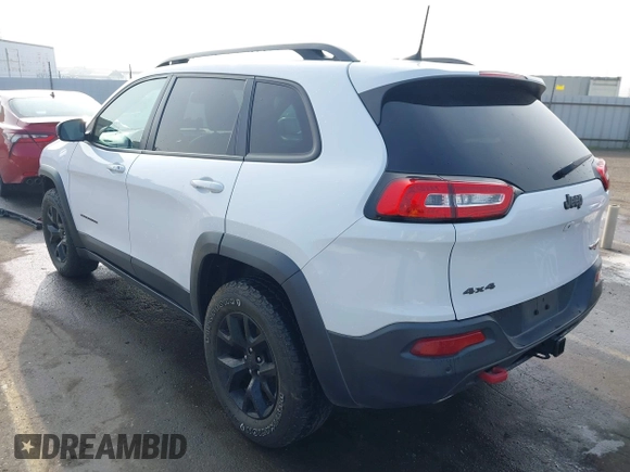 2018 Jeep Cherokee Trailhawk z VIN 1C4PJMBX8JD525945, wystawiony jako IAAI lot #41008604 z przebiegiem 111 086 mil mil oraz . Historia ofert i sprzedaży dostępna na DreamBid. Obrazek 3.