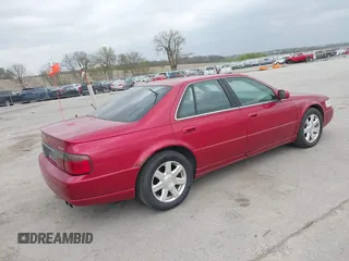 2001 Cadillac Seville z VIN 1G8KS54Y91U227846, wystawiony jako IAAI lot #42134095 z przebiegiem 216 766 mil mil oraz . Historia ofert i sprzedaży dostępna na DreamBid. Obrazek 4.