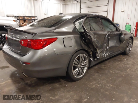 2014 Infiniti Q50 Premium with VIN JN1BV7ARXEM699902, listed as a IAAI auction lot 42135410 with 103,929 mi miles and . Bid and sale history available at DreamBid. Image 4.