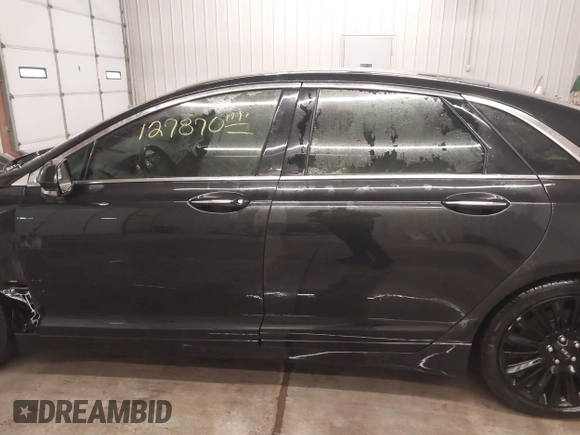 2015 Lincoln MKZ z VIN 3LN6L2J95FR620390, wystawiony jako IAAI lot #41586267 z przebiegiem 127 870 mil mil oraz . Historia ofert i sprzedaży dostępna na DreamBid. Obrazek 14.